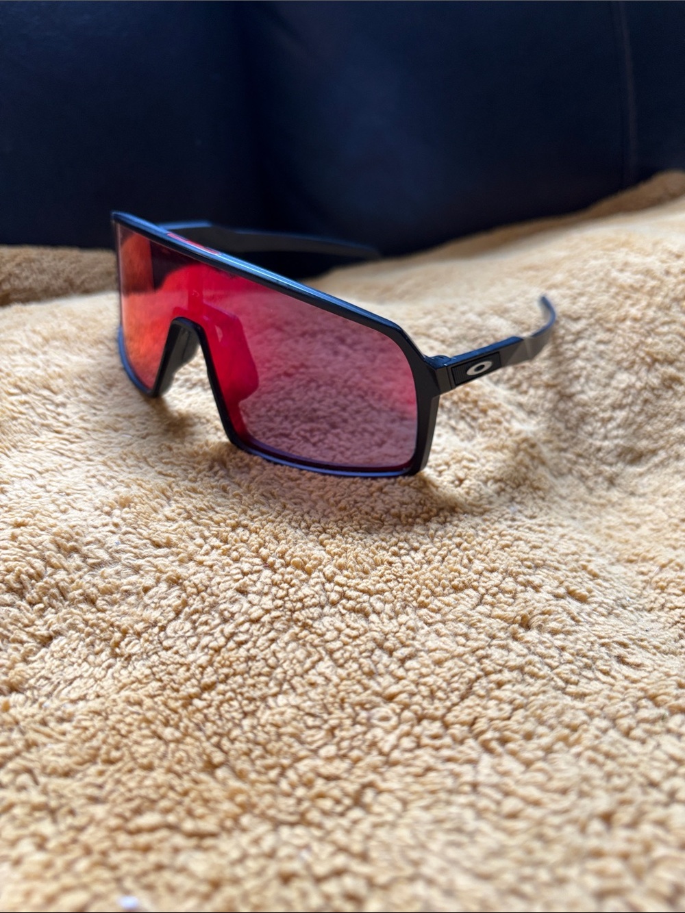 Oakley Black Frame Sunglasses with Red Mirrored Shield Lens